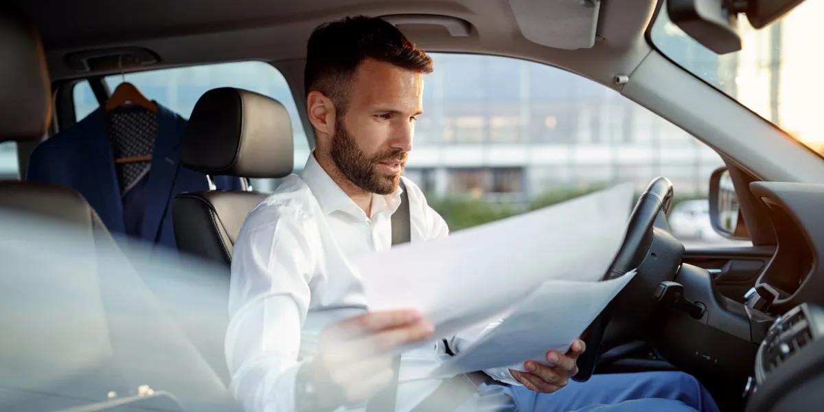 Understanding the true cost of car ownership requires tracking fuel, maintenance, insurance, taxes, inspections, and vehicle depreciation. Driver calculating total car ownership costs in Germany including fuel, insurance, maintenance, taxes, and vehicle documents.